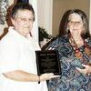 Last year's Citizen of the Year, Julie Erwin accepting from Sandy Sheets